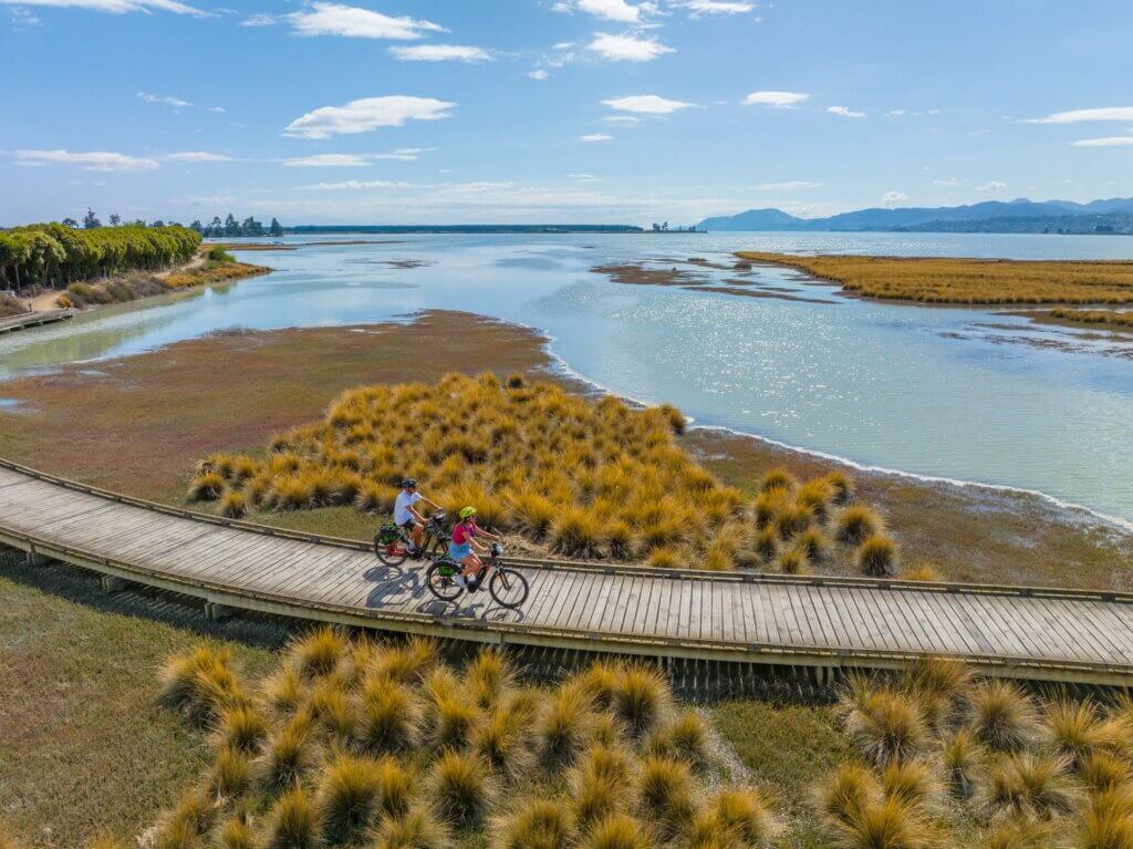 Cyclists on the Waimea Inlet, Great Taste Trail Nelson