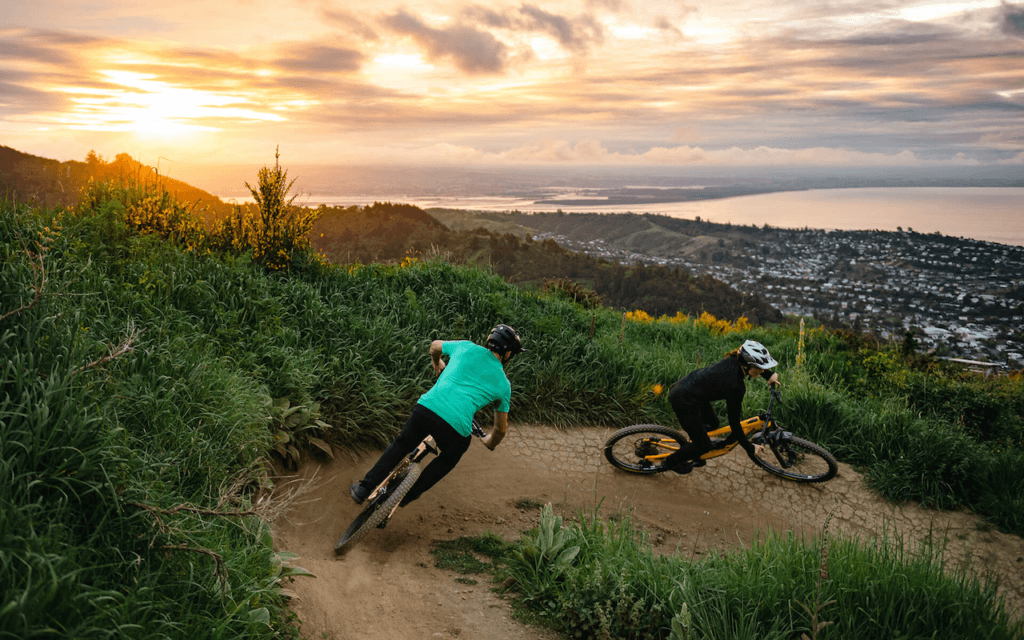 Mountain Bikers riding at the Codgers MTB Park Nelson, New Zealand
