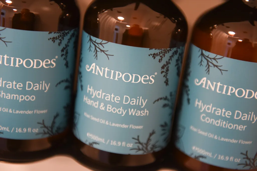 Antipodes eco-friendly Hydrate Daily shampoo, conditioner and hand and body wash in amber bottles